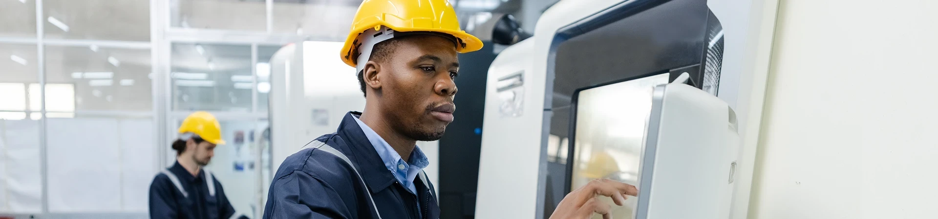 CNC Machinist Certificate machinists working on product