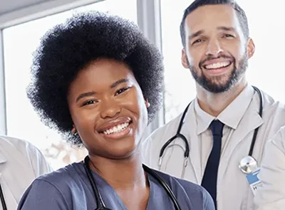 smiling healthcare workers in the Healthcare Management Technology field